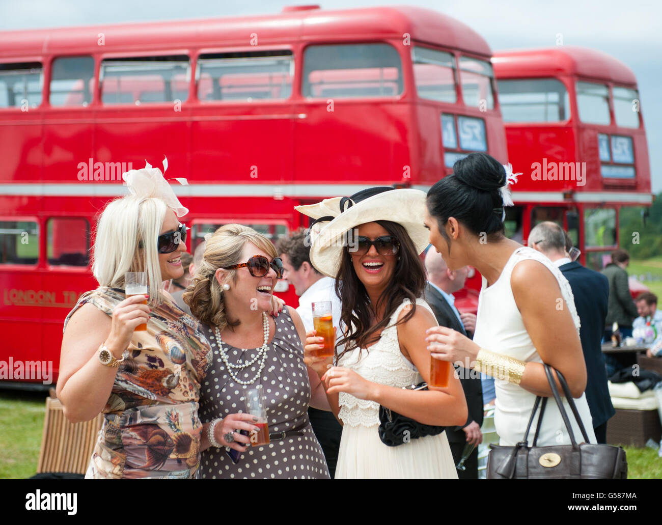 Racegoers enjoy a drink during Investec Ladies' Day of the Investec Derby Festival at Epsom Racecourse. PRESS ASSOCIATION Photo. Picture date: Friday June 1, 2012. See PA story RACING Epsom. Photo credit should read: Dominic Lipinski/PA Wireduring Investec Ladies' Day of the Investec Derby Festival at Epsom Racecourse. PRESS ASSOCIATION Photo. Picture date: Friday June 1, 2012. See PA story RACING Epsom. Photo credit should read: Dominic Lipinski/PA Wire Stock Photo