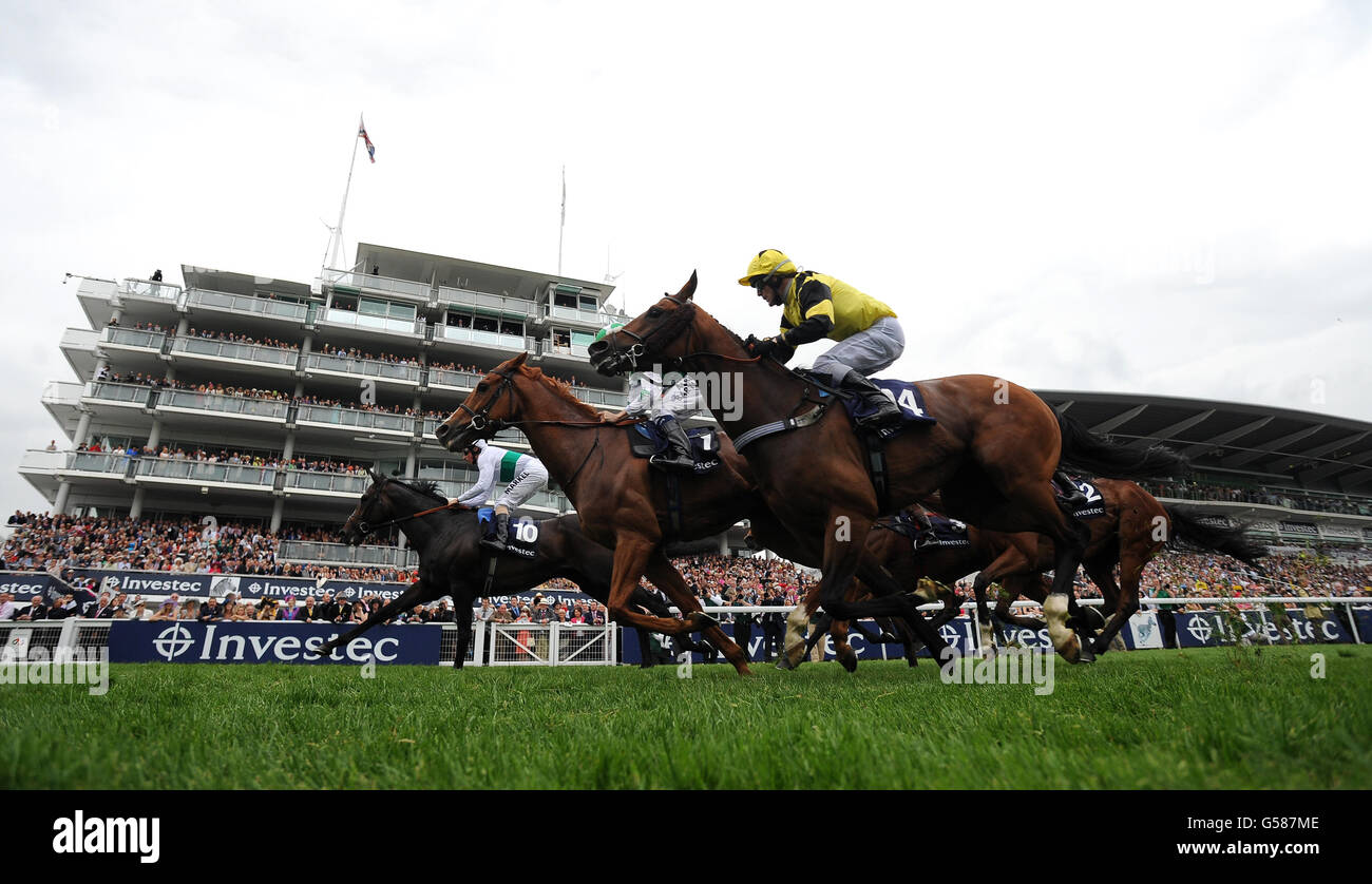Gatewood ridden by William Buick (left) wins of The Investec Wealth and Investment Stakes during Investec Ladies' Day of the Investec Derby Festival at Epsom Racecourse. Stock Photo