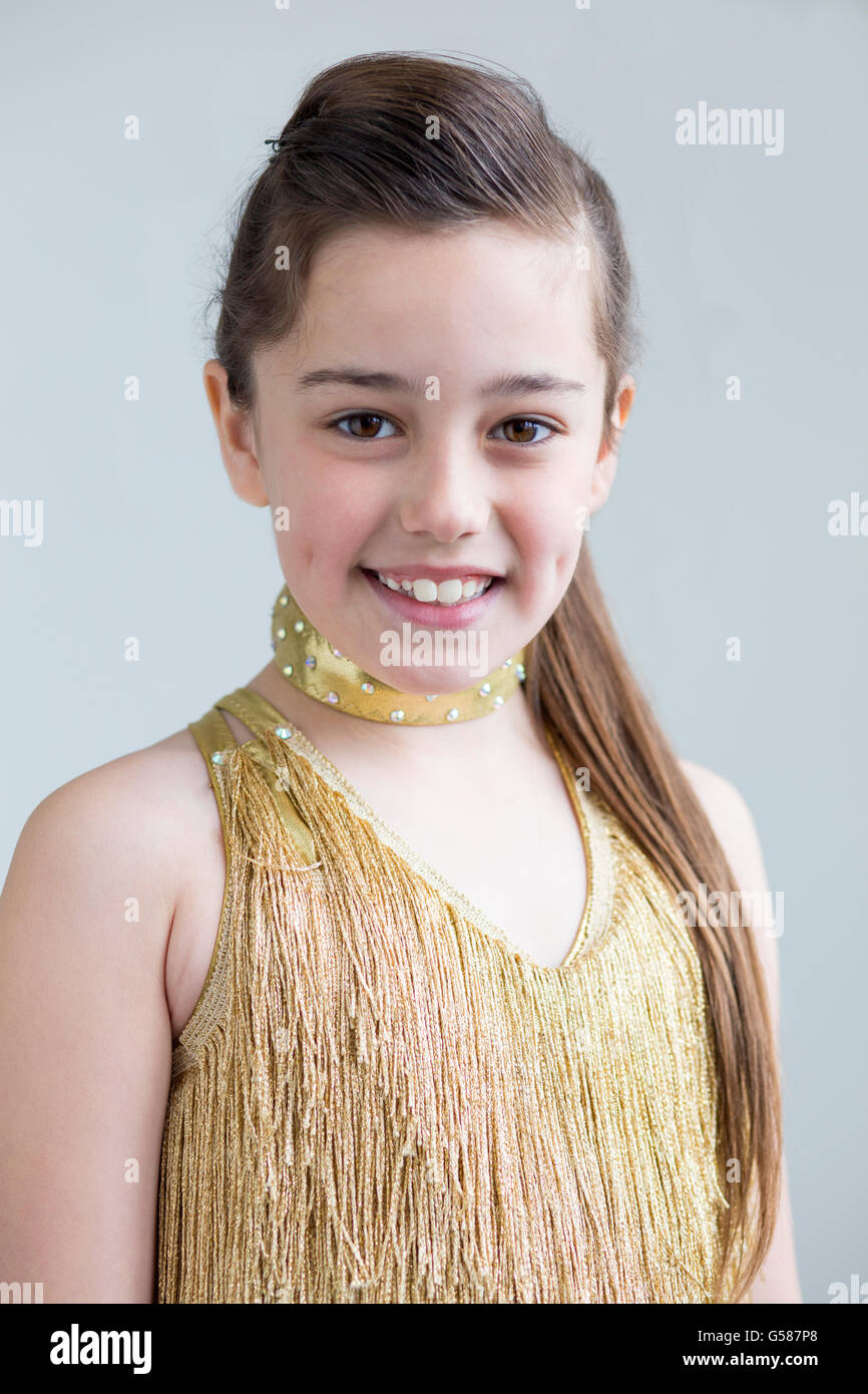 Young girl posing for the camera in her dance costume. Stock Photo