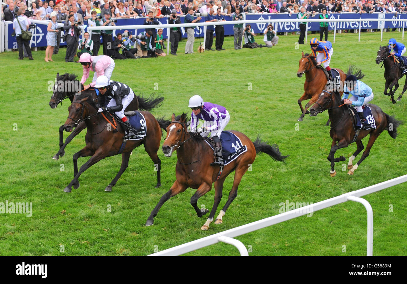 Was, (number 14) ridden by Seamie Heffernan wins the Investec Oaks during Investec Ladies' Day of the Investec Derby Festival at Epsom Racecourse. Stock Photo