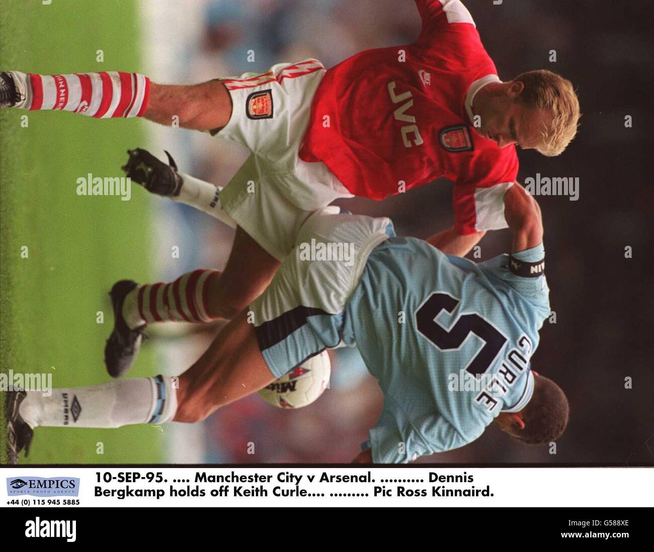 10-SEP-95. Manchester City v Arsenal. Dennis Bergkamp holds off Keith Curle Stock Photo