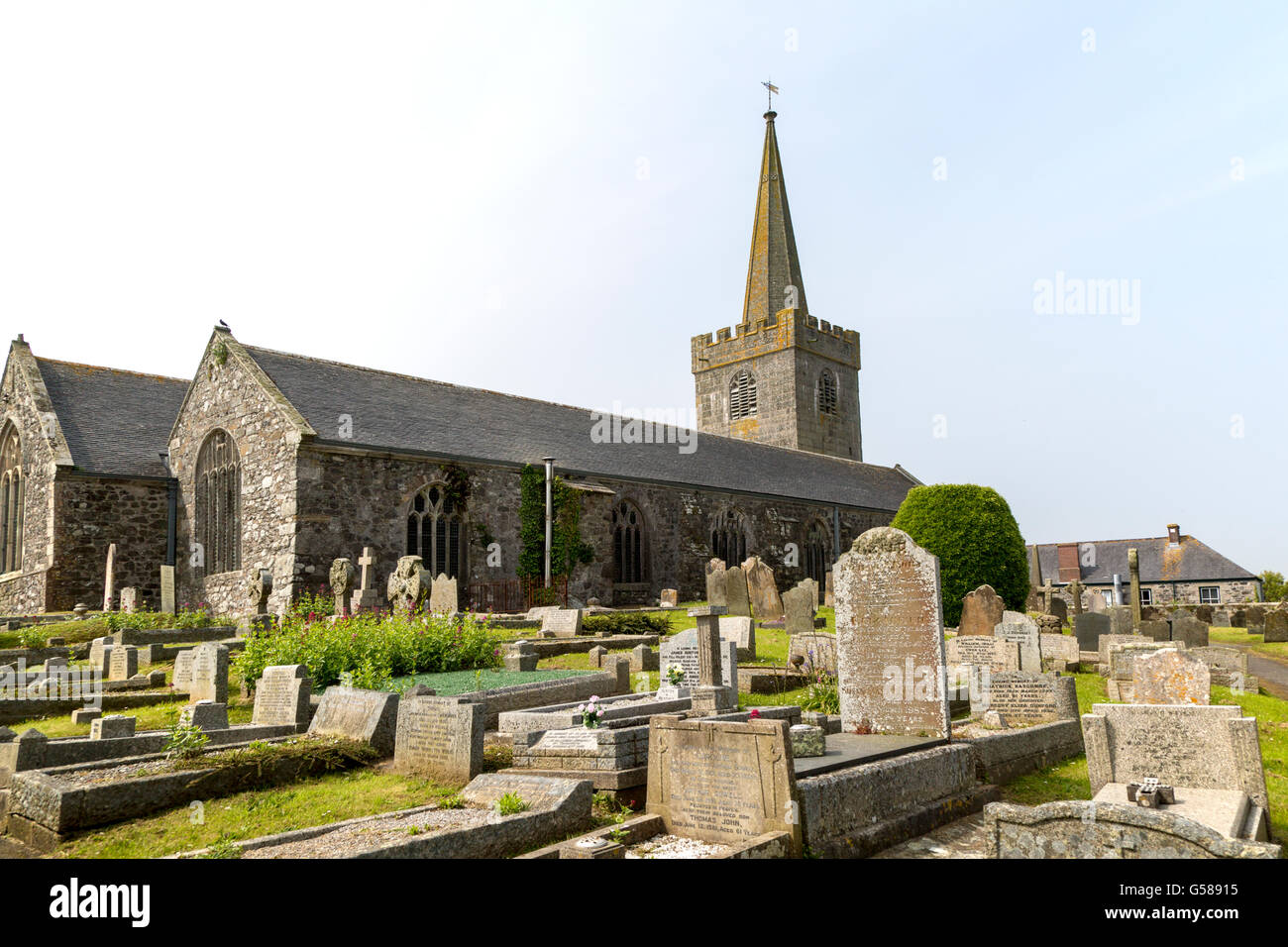 Spire and gravestones village parish church at St Keverne, Lizard Peninsula, Cornwall, England, UK Stock Photo