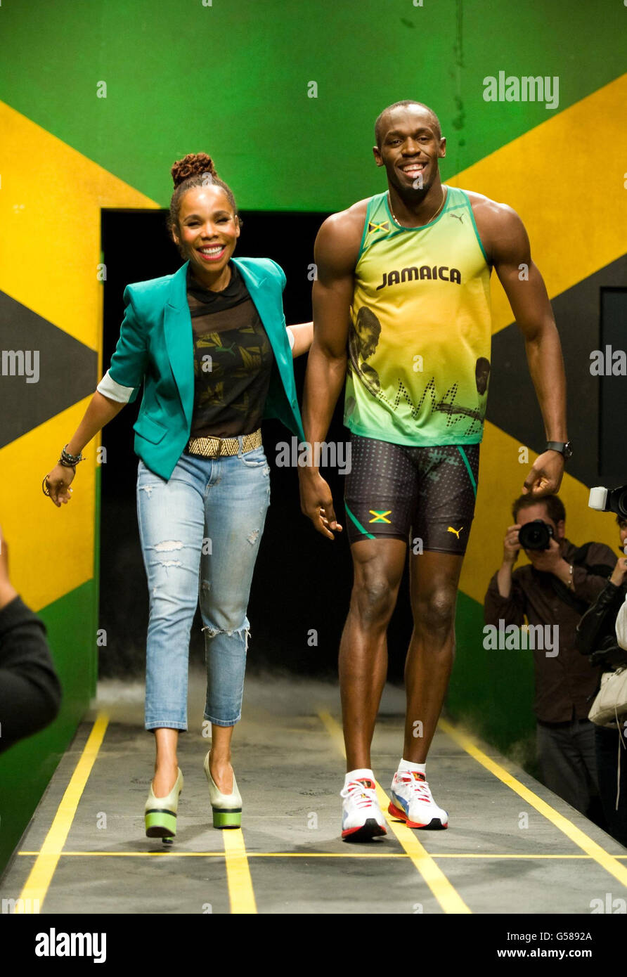 Jamaican sprinter Usain Bolt wearing the 2012 Jamaican Olympic kit with  designer Cedella Marley during a photocall at Village Underground, London  Stock Photo - Alamy
