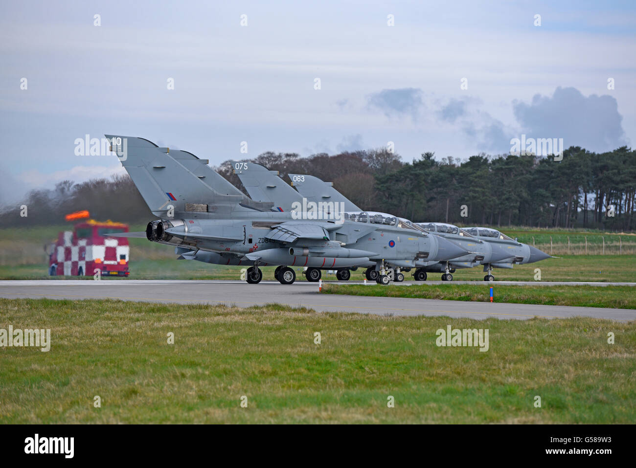 Lined up and ready for take off, four RAF GR4 Tornadoes at Lossiemouth Air Station Moray Scotland.  SCO 10,526. Stock Photo