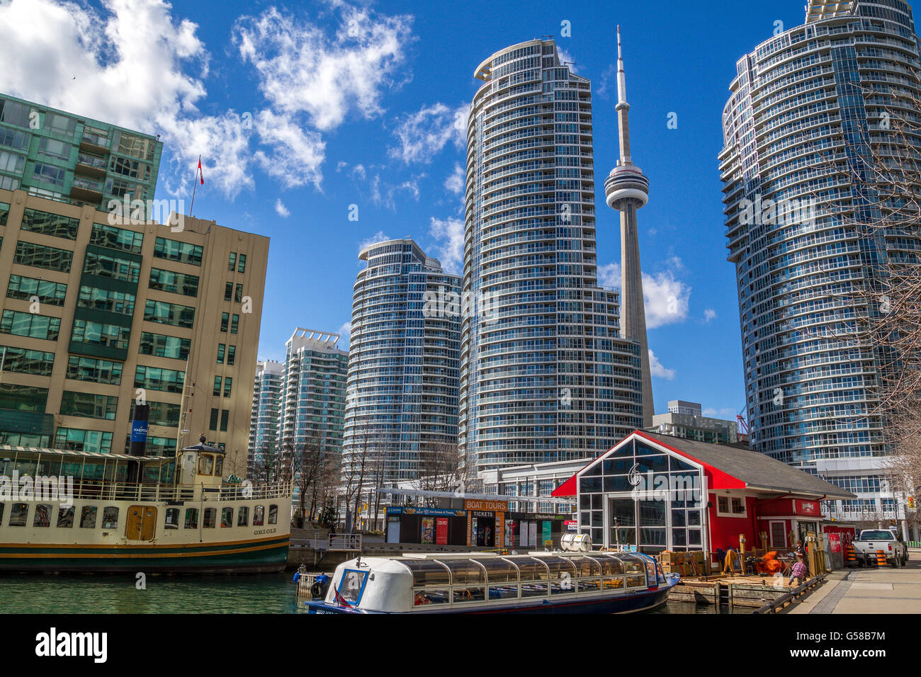 The CN Tower seen between tall apartment building on The Toronto ...