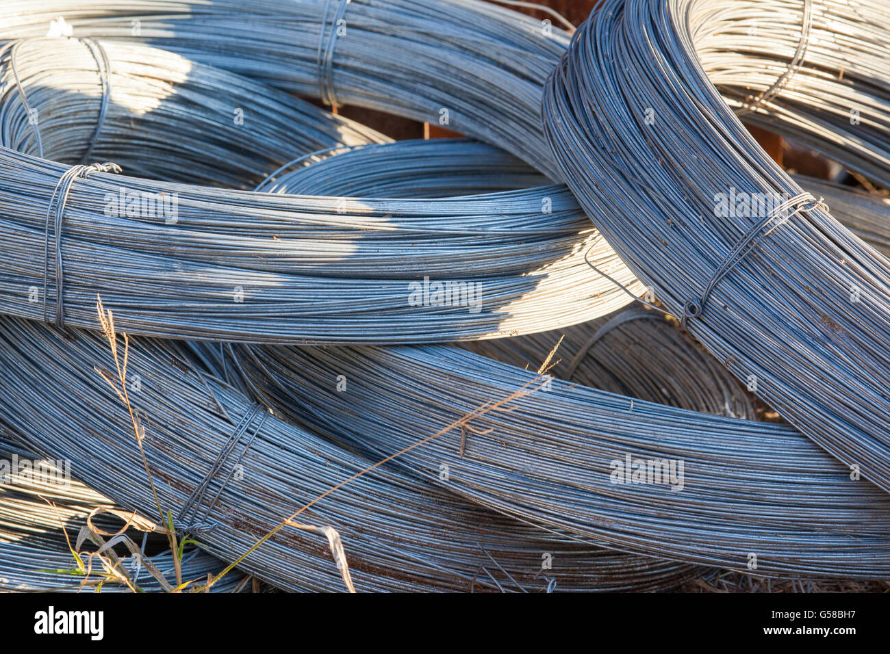 Rolls of stainless steel wire for use of fencing and industrial Stock Photo