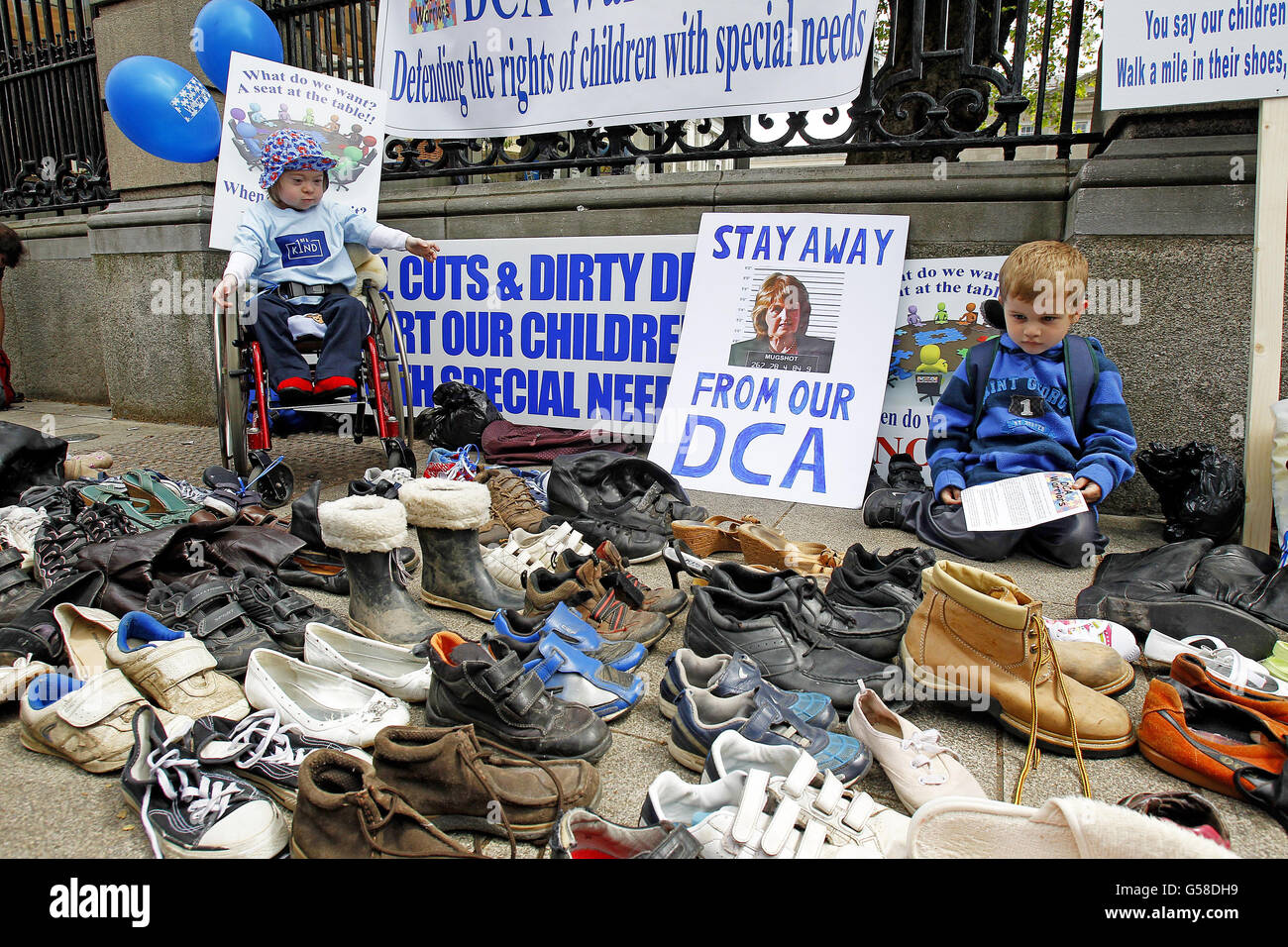 Jack McNiffe, seven, and Craig O'Donnell, five, (right) at the protest outside Leinster House in Dublin organised by parents of special needs children, the DCA Warriors,a group set up due to the Department of Social Welfare sending reviews to parents who already received Domiciliary Care Allowance from August 2009. Stock Photo