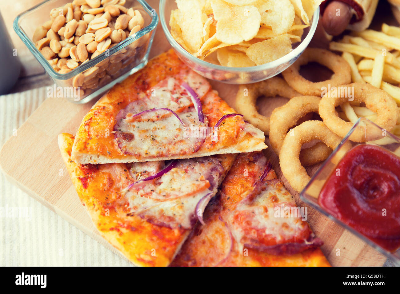 close up of fast food snacks and drink on table Stock Photo - Alamy