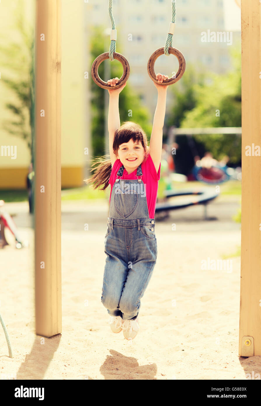 happy little girl on children playground Stock Photo - Alamy