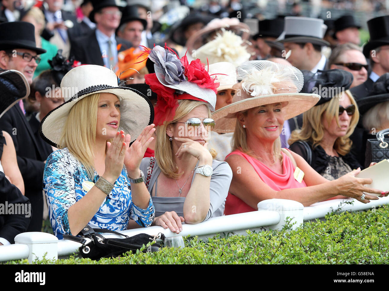 Race goers watch during day one of the 2012 Royal Ascot meeting at Ascot Racecourse, Berkshire. Stock Photo