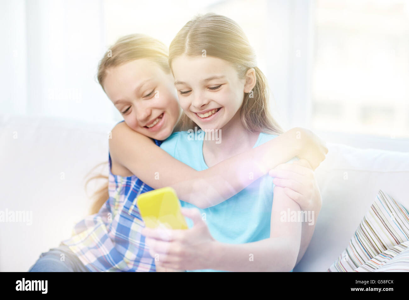 happy girls with smartphone taking selfie at home Stock Photo - Alamy