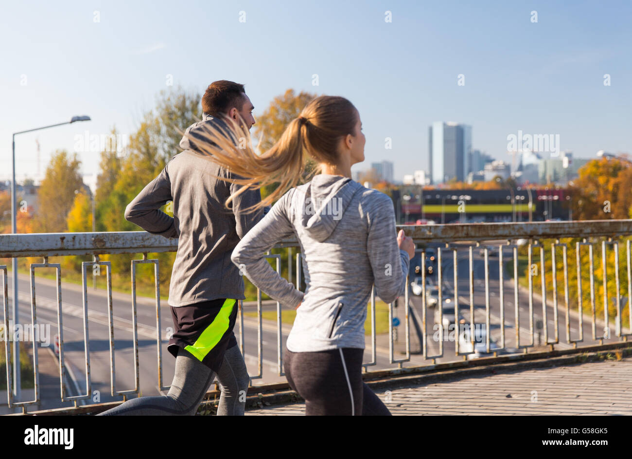 happy couple running outdoors Stock Photo - Alamy