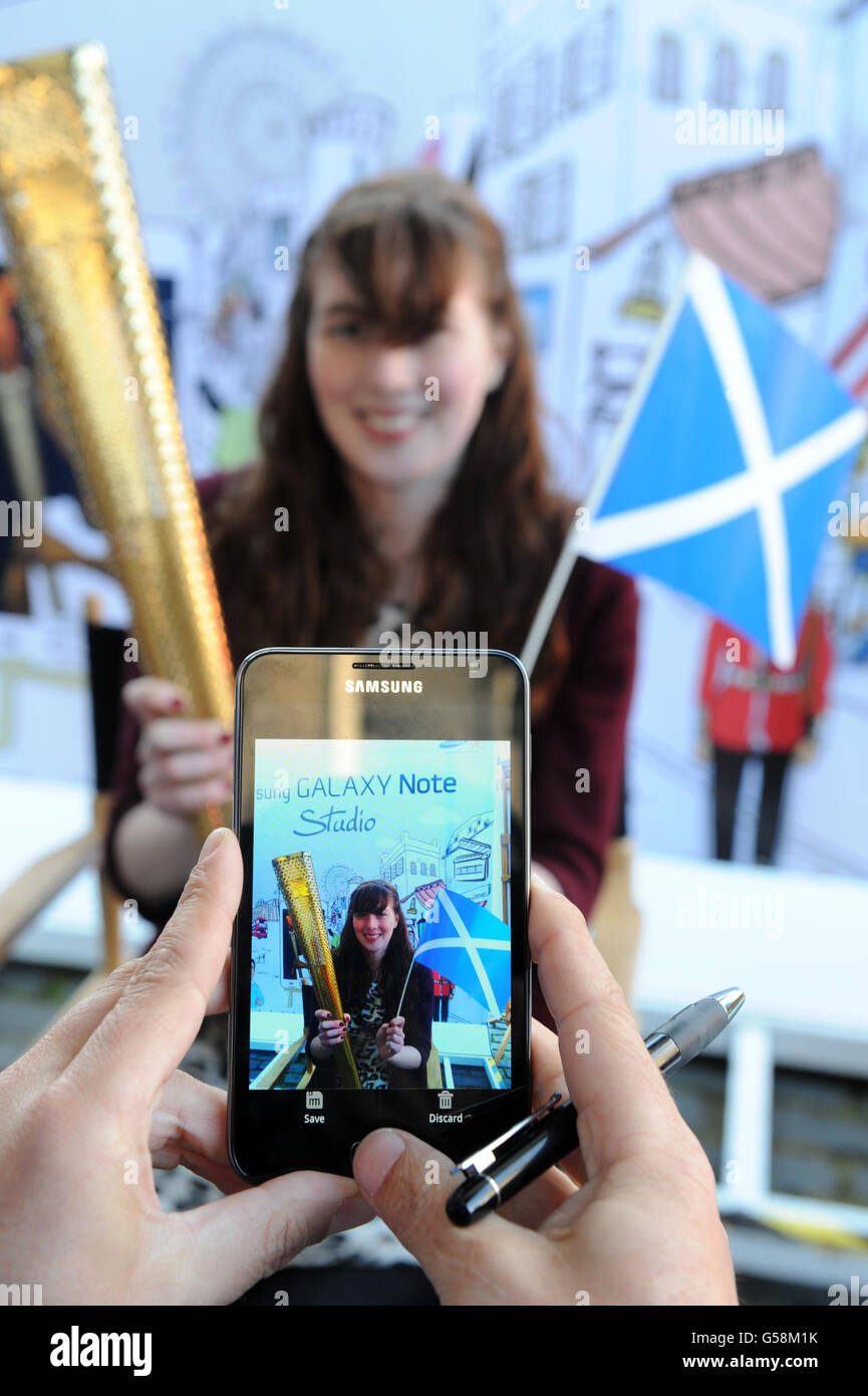 Rachael Fraser from Edinburgh, has her picture taken in the Samsung studio in Parliament Sq Edinburgh, with a Samsung Galaxy Note phone, in the Samsung Mobile PIN a pop-up experience space which has travelled across the UK alongside the Olympic Torch Relay route. Stock Photo