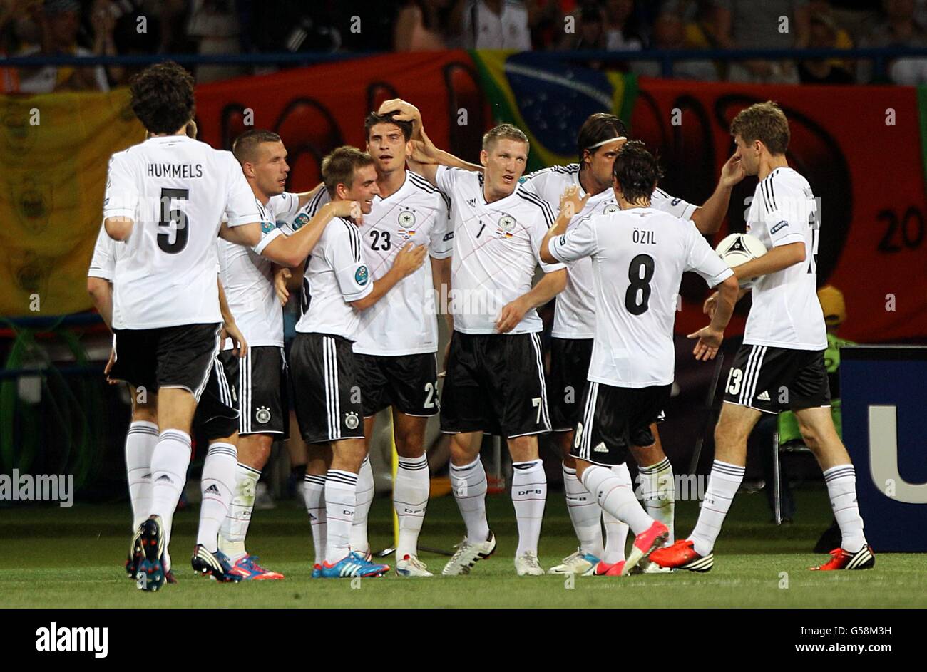 Germany's Mario Gomez (centre left) celebrates with his team-mates after scoring his side's first goal of the game Stock Photo