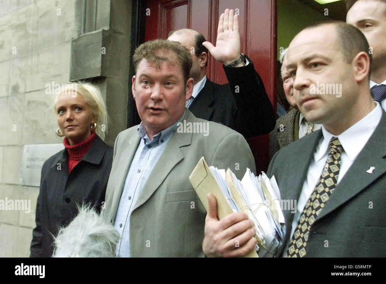 Pounds and ounces fruit and vegetable trader Steven Thoburn (C) talks to the press with his wife Leigh (L) and campaigner Neil Herron, outside Sunderland Magistrates' Court. He was told that he must wait until April 2001 before learning his fate. * The father-of-two is being prosecuted by Sunderland City Council for using imperial measures only scales, instead of metric weights, at his market stall in Sunderland. His stall was raided by trading standards officers in July last year and his scales were seized. On the third day of the hearing District Judge John Morgan told Mr Thoburn that it Stock Photo