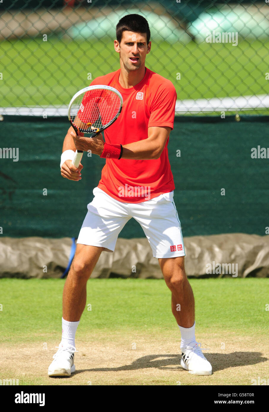 Serbia's Novak Djokovic on the practice courts during a practice day of the 2012 Wimbledon Championships at the All England Lawn Tennis Club, Wimbledon. Stock Photo