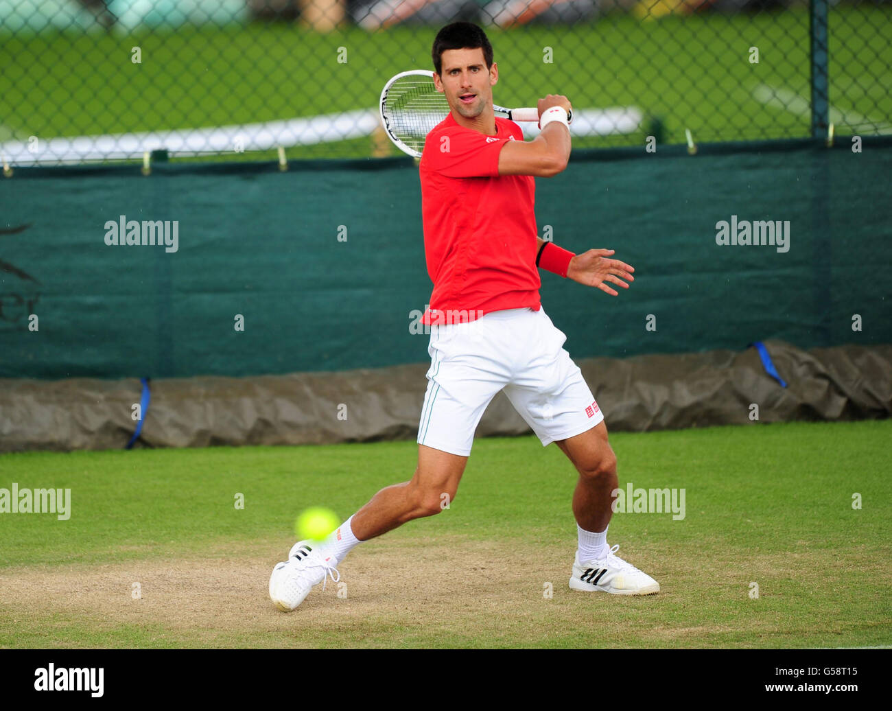 Serbia's Novak Djokovic on the practice courts during a practice day of the 2012 Wimbledon Championships at the All England Lawn Tennis Club, Wimbledon. Stock Photo
