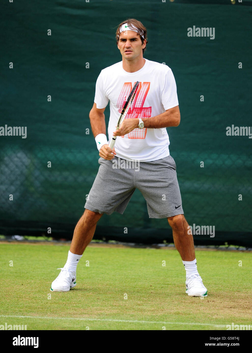 Switzerland's Roger Federer on the practice courts during a practice day of the 2012 Wimbledon Championships at the All England Lawn Tennis Club, Wimbledon. Stock Photo