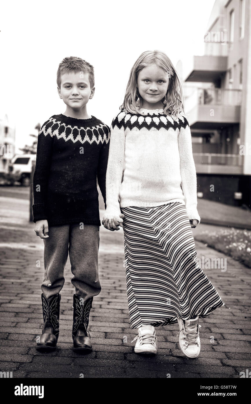 Children holding hands boy and girl hi-res stock photography and images ...
