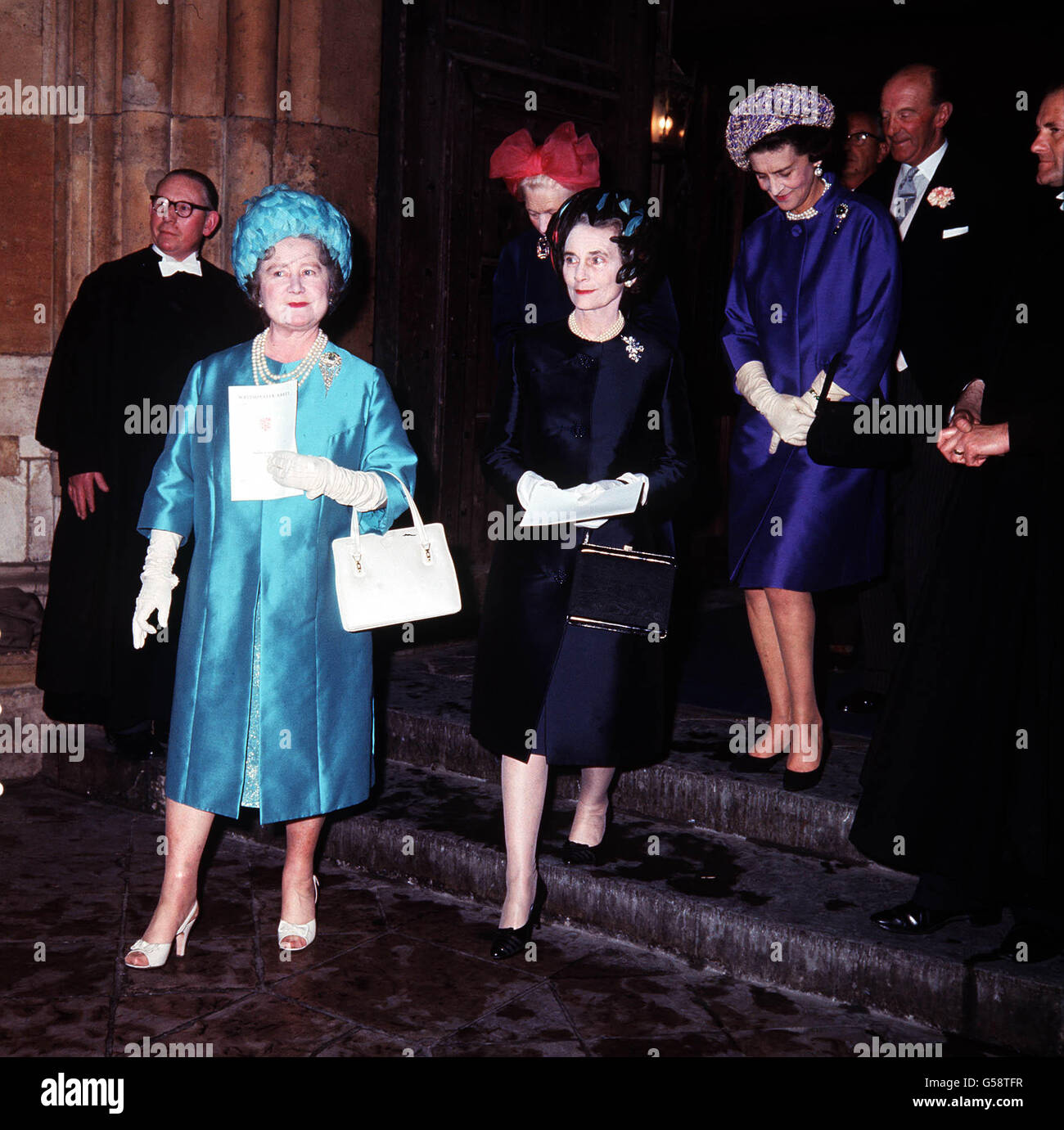1966: The Queen Mother (left), the Duchess of Gloucester (c) and Princess Marina of Kent leaving after the wedding of the Marquess of Hamilton and Miss Alexandra Phillips at Westminster Abbey, London. Stock Photo