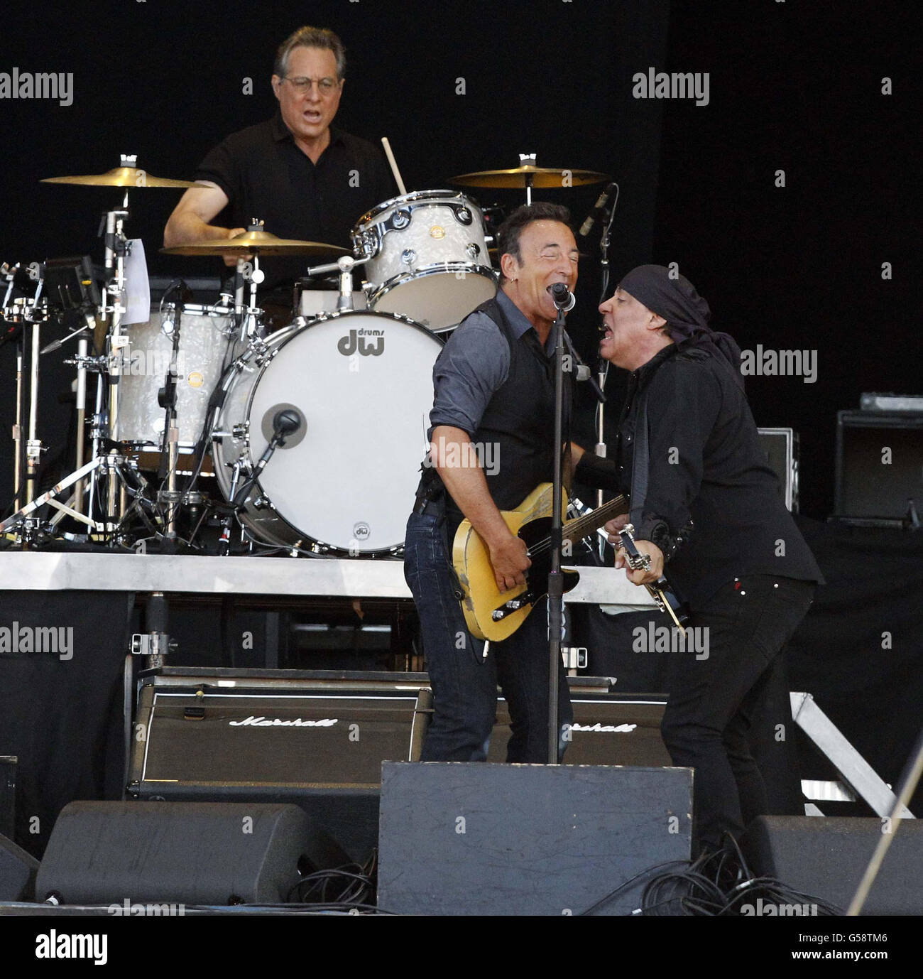 Bruce Springsteen (centre) performs on the main stage at the Isle of Wight Festival. Stock Photo