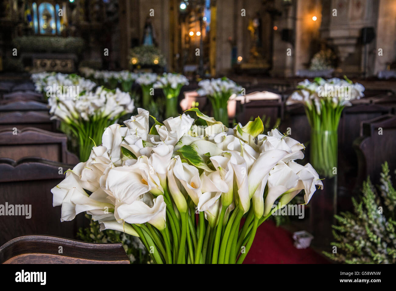 White lilies in a church, Salvador, Brazil Stock Photo