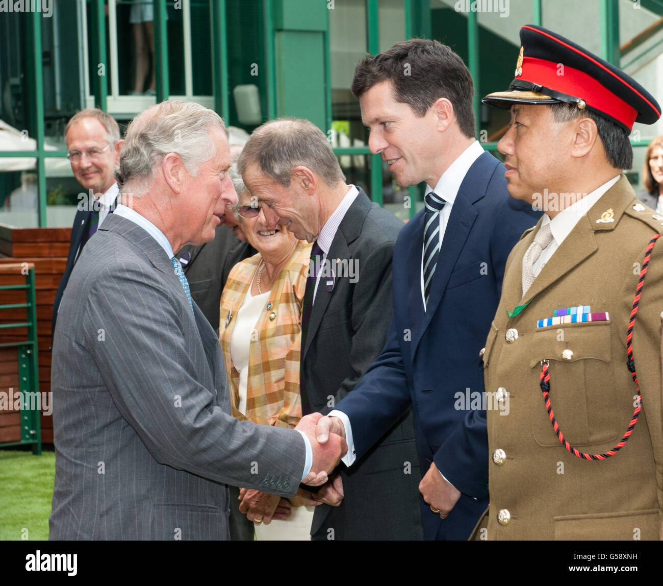 The Prince of Wales (left) meets Tim Henman on day three of the 2012 Wimbledon Championships, at the All England Lawn Tennis Club, Wimbledon, London. Stock Photo
