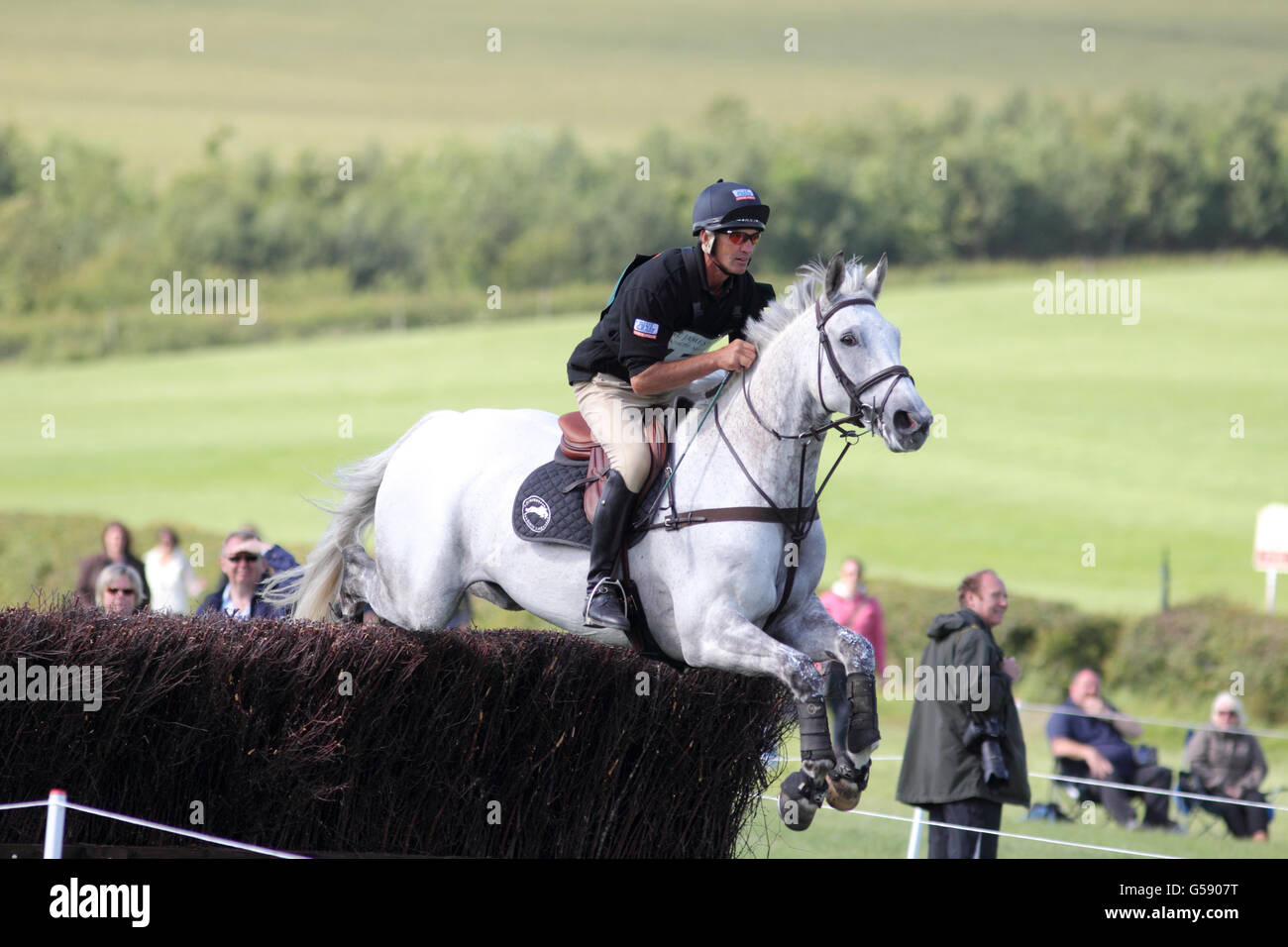 New Zealand's Andrew Nicholson rides Avebury in the St James's Place Barbury International Horse Trials during day three of the Barbury International Horse Trials at Barbury Castle Estate, Wiltshire. Stock Photo
