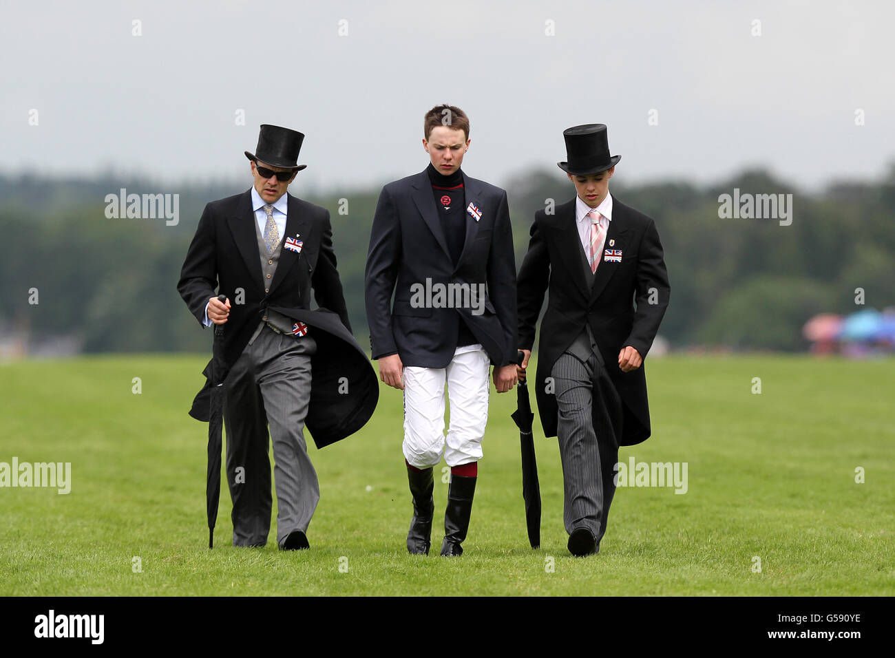 Trainer Aidan O'Brien (left) and his sons Joseph (centre) and Donncha walk the course before day four of The Royal Ascot Meeting 2012 Stock Photo