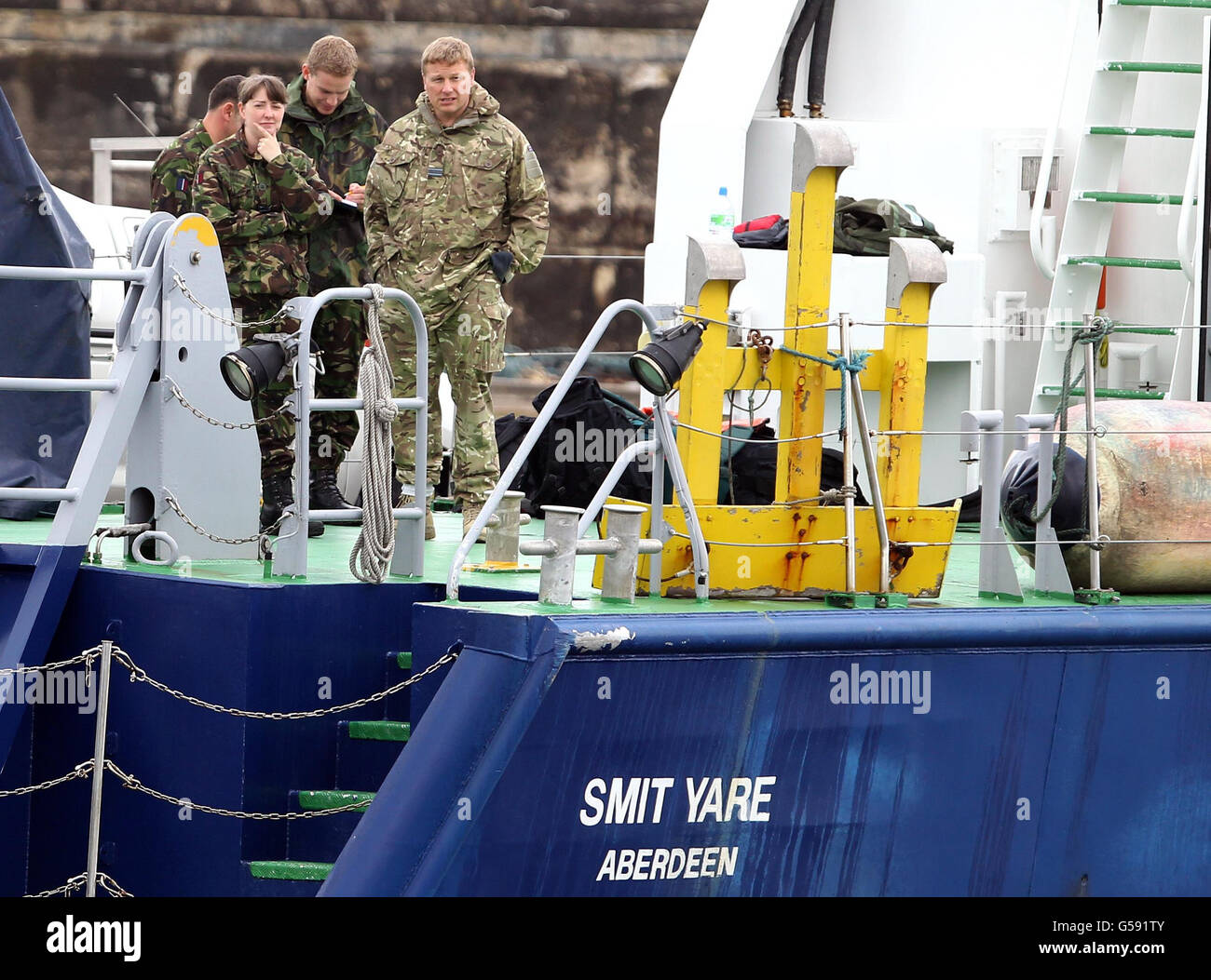 RAF personnel on board 'Smit Yare', a vessel at Buckie harbor on the Moray coast, as the vessel appeared to be preparing to leave port to take part in the salvage operation, after two Tornados crashed yesterday. Wreckage was brought ashore last night by Buckie Lifeboat. Stock Photo