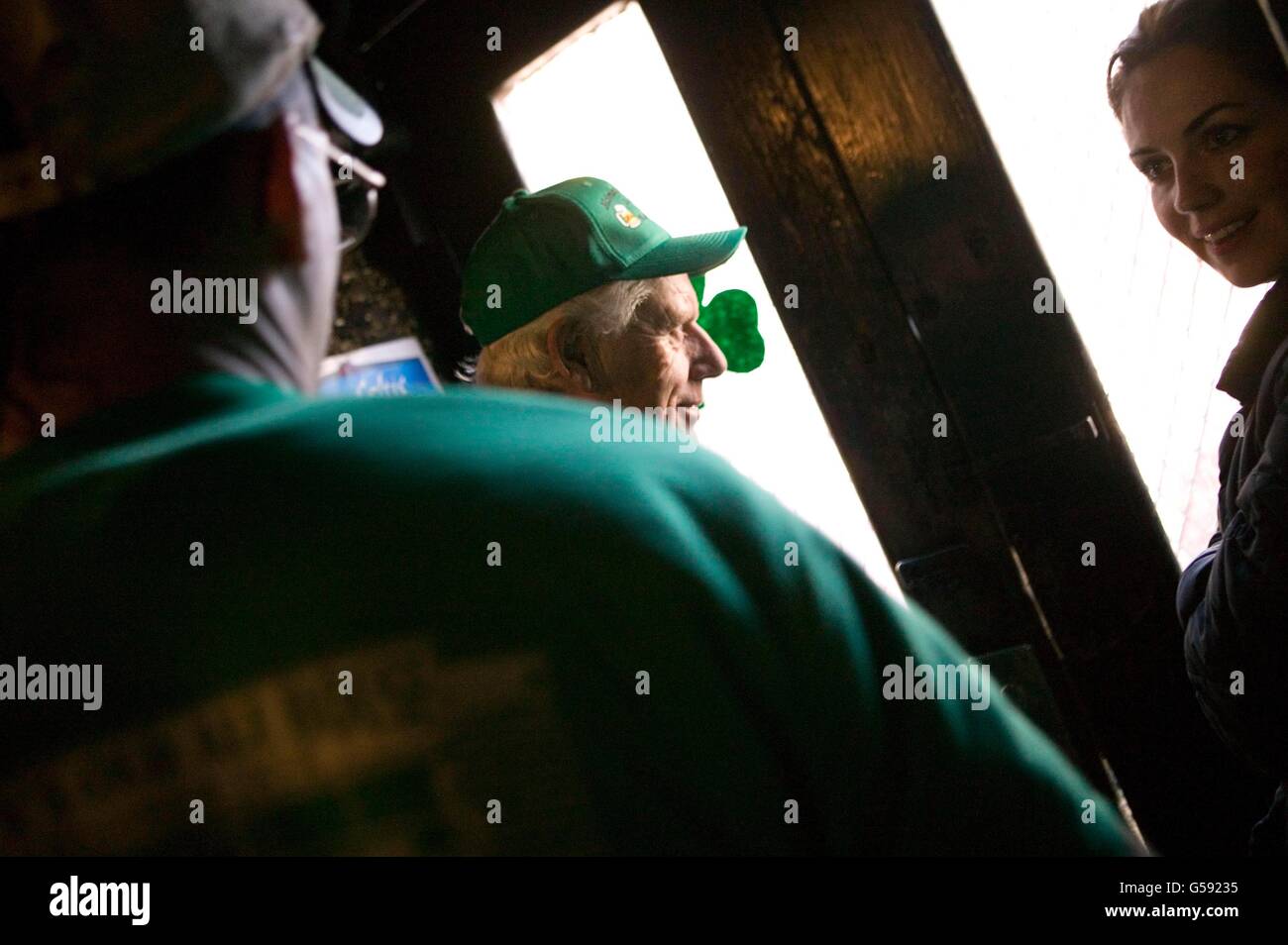 Richie Buggy (C) looks out of McSorley's in New York City, at the line formed outside, early on 17 March 2006, St Patrick's Day Stock Photo