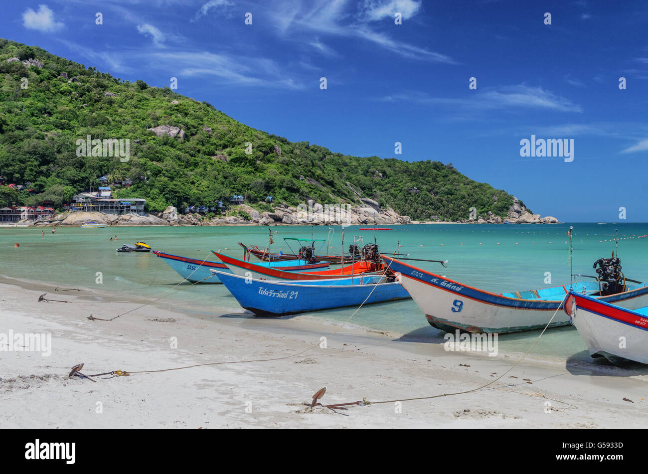 Boats at anchor on Haad Rin beach, Koh Phangan. Stock Photo