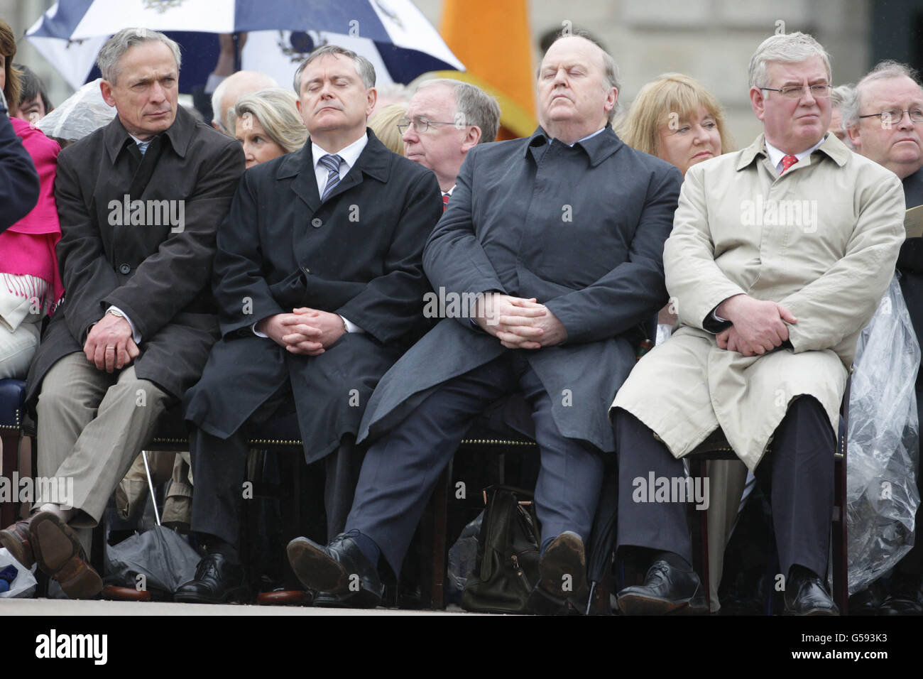 (left to right) Cabinet ministers, Richard Bruton, Brendan Howlan, Michael Noonan and Eamon Gilmore during the National Day of Commemoration Ceremony, held to honour all Irishmen and Irishwomen who died in past wars or on service with the United Nations, at the National Museum of Ireland, Collins Barracks, Dublin. Stock Photo