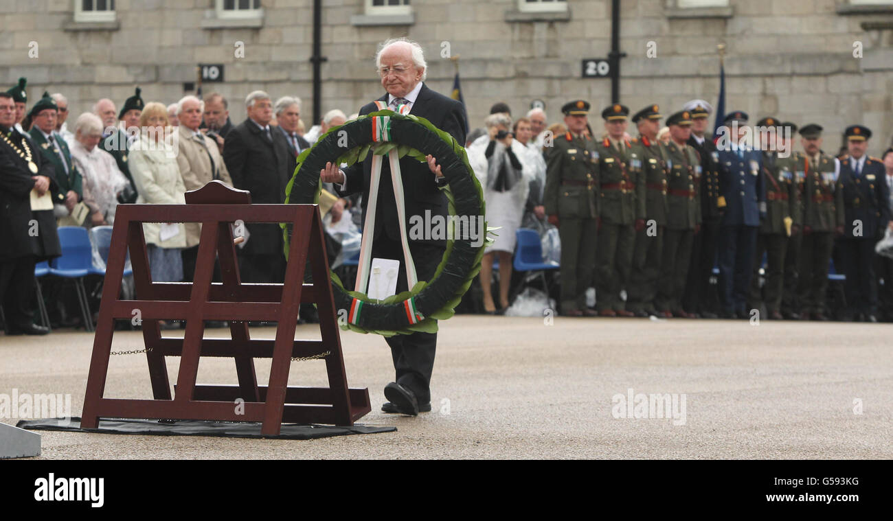 President Michael D Higgins lays a wreath of behalf of the state during the National Day of Commemoration Ceremony, held to honour all Irishmen and Irishwomen who died in past wars or on service with the United Nations, at the National Museum of Ireland, Collins Barracks, Dublin. Stock Photo