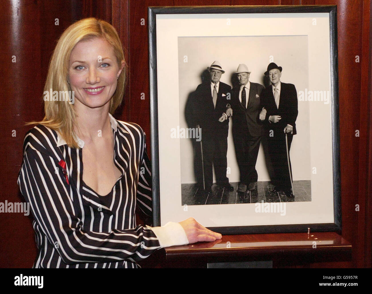Actress Joely Richardson stands, with a photographic portrait by Terence Donovan of Sir Ralph Richardson, left, Sir Laurence Olivier, centre and Sir Alec Guinness, taken in 1980 on condition that it was only to be published after their deaths. * The photograph is to be auctioned with 53 other lots at Christie's, London on 22 January to raise funds for the HIV charity, the London Lighthouse. R/I: 23/01/01. Stock Photo