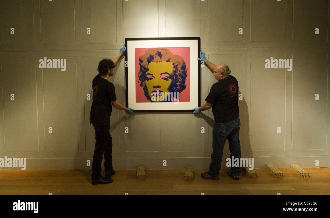 A silk screen print of Marilyn Monroe by Andy Warhol is hung at the Dulwich Picture Gallery ahead of a major new exhibition of the US artist's work. Stock Photo