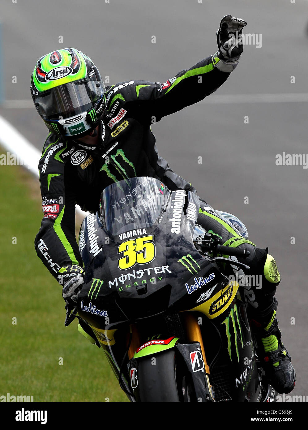Motorcycling - 2012 Hertz British Grand Prix - Day Three - Race - Moto GP - Silverstone. Great Britain's Cal Crutchlow acknowledges the crowd after the British round of Moto GP at Silverstone Circuit, Northamptonshire. Stock Photo
