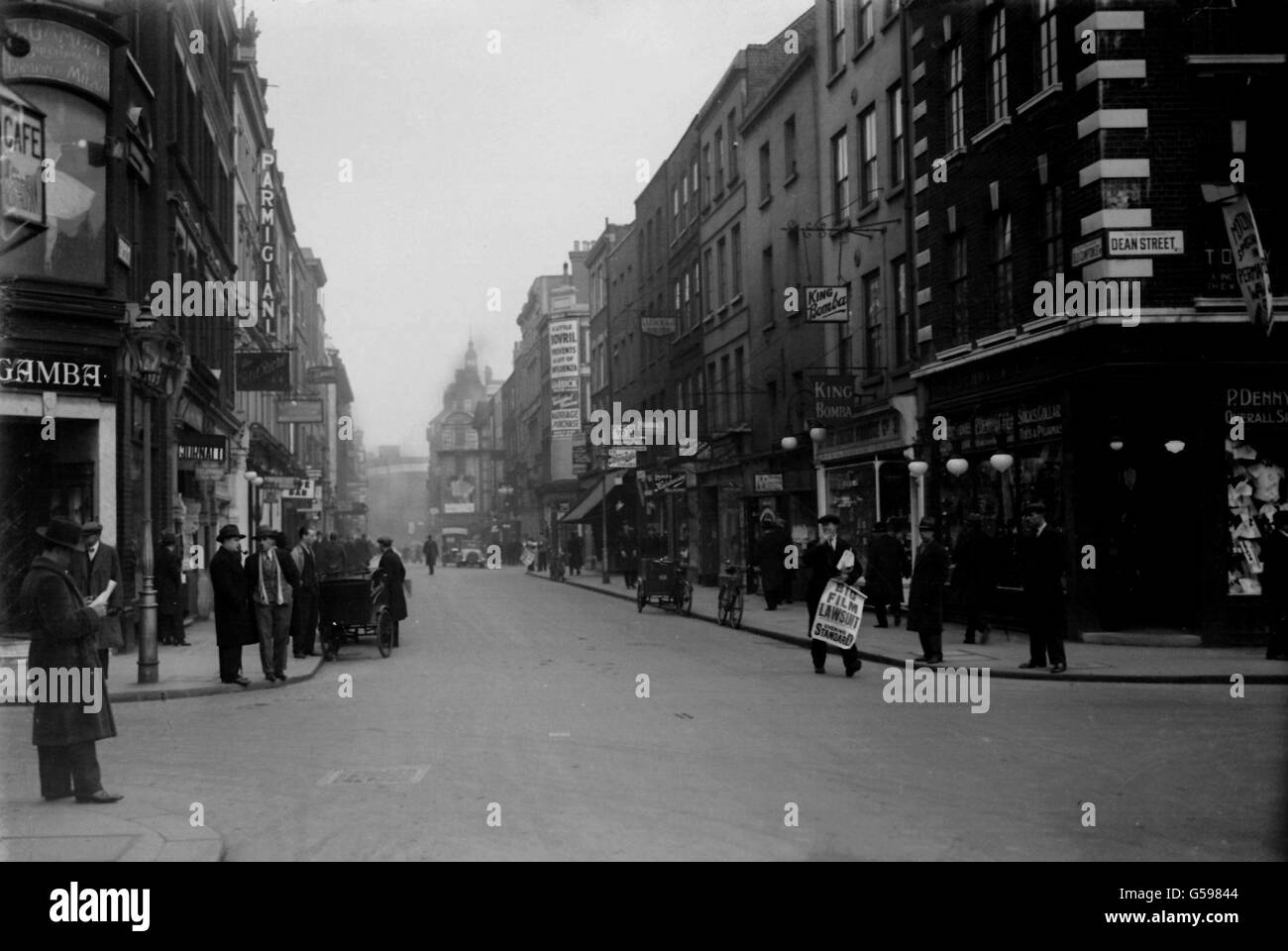 OLD COMPTON STREET, LONDON 1932: A view of the corner of Old Compton Street and Dean Street in the Soho area of London. Stock Photo