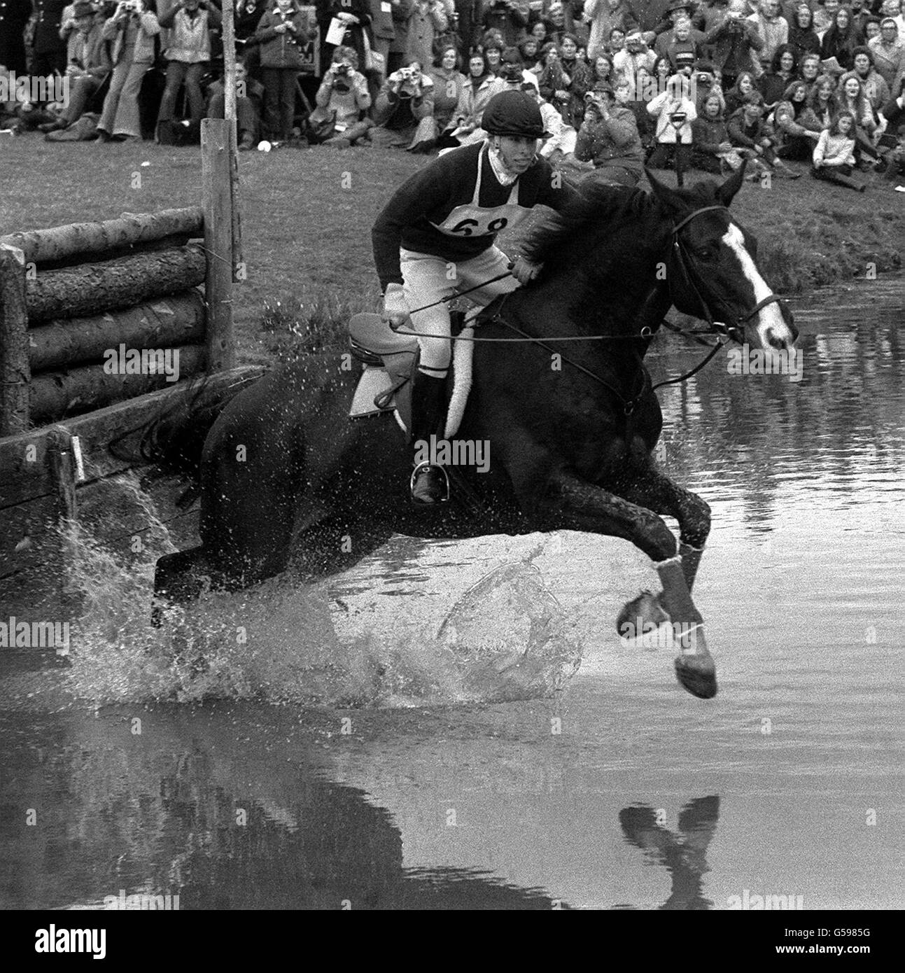 Princess Anne up on Goodwill, takes the water-jump during the cross-country event of the Badminton Horse Trials. Her round went off without mishap and she is well placed to improve her position in the final show jumping test if the riders above her pick up faults. The event was watched by The Queen, Prince Philip and other members of the Royal Family. Stock Photo