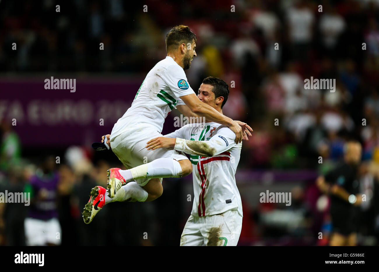 Portugal's Cristiano Ronaldo (right) celebrates his side's victory with team-mate Miguel Veloso after the final whistle Stock Photo