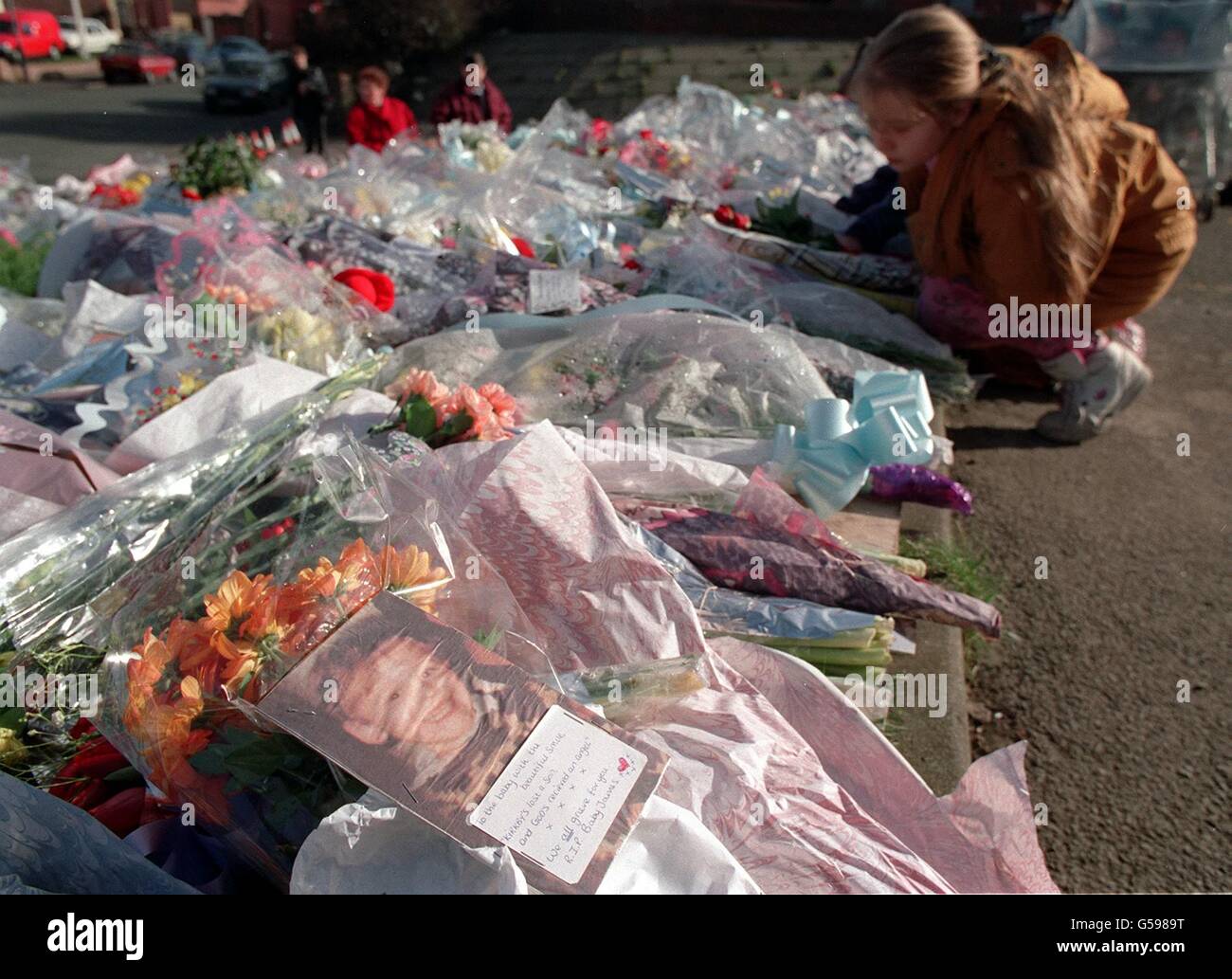 A photograph of murdered twoyearold James Bulger lies beside the