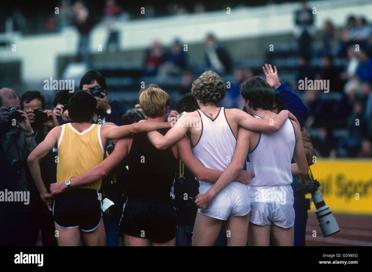 Athletes, left to right, Sebastian Coe, Peter Elliott, Steve Cram and Garry Cook surrounded by the media after their 4 x 800 metres relay world record of 7:03.89 Stock Photo