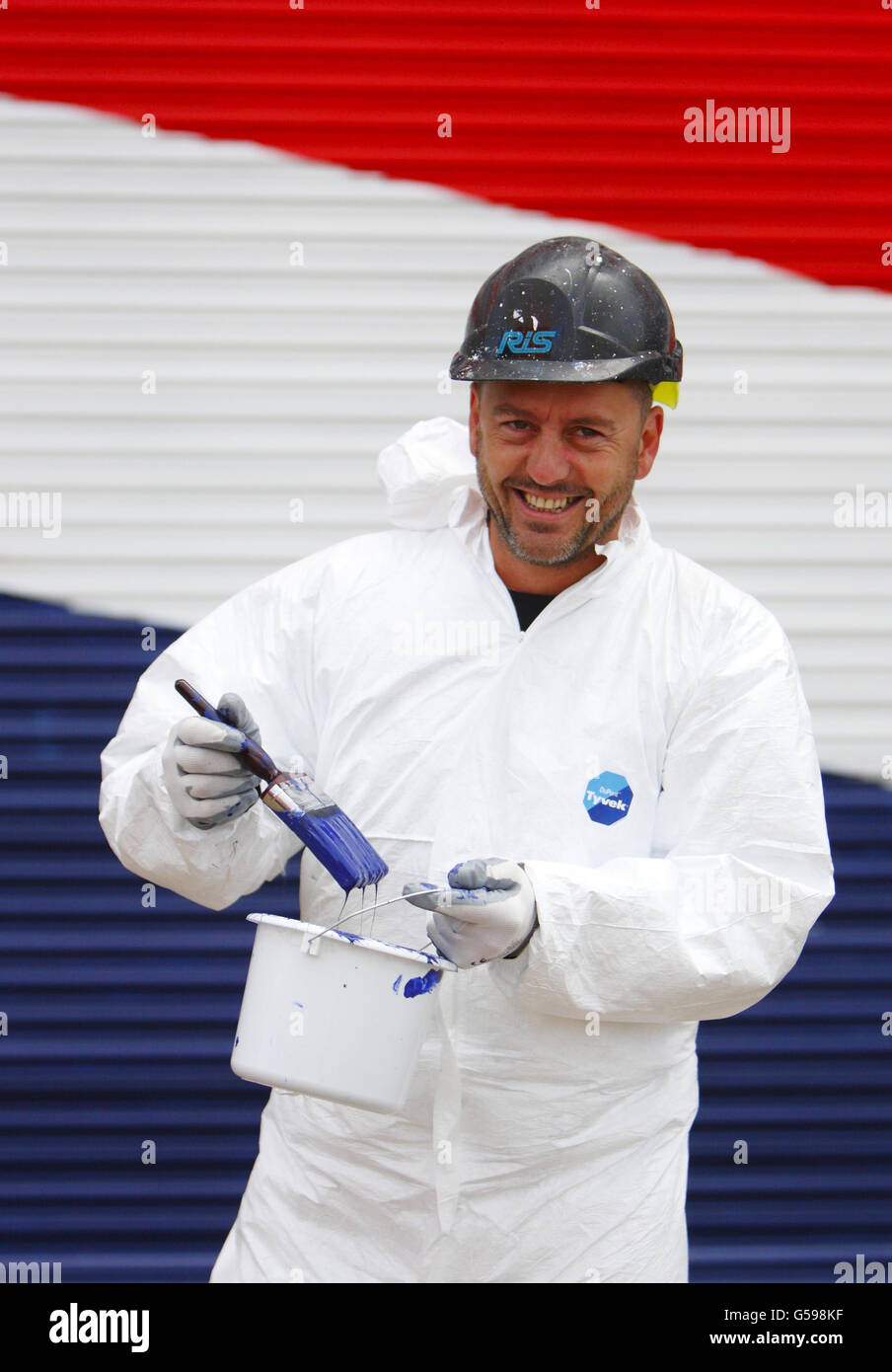 Rob Saunders Painter Rob Saunders paints the giant hangar doors at Venture Quays in ...