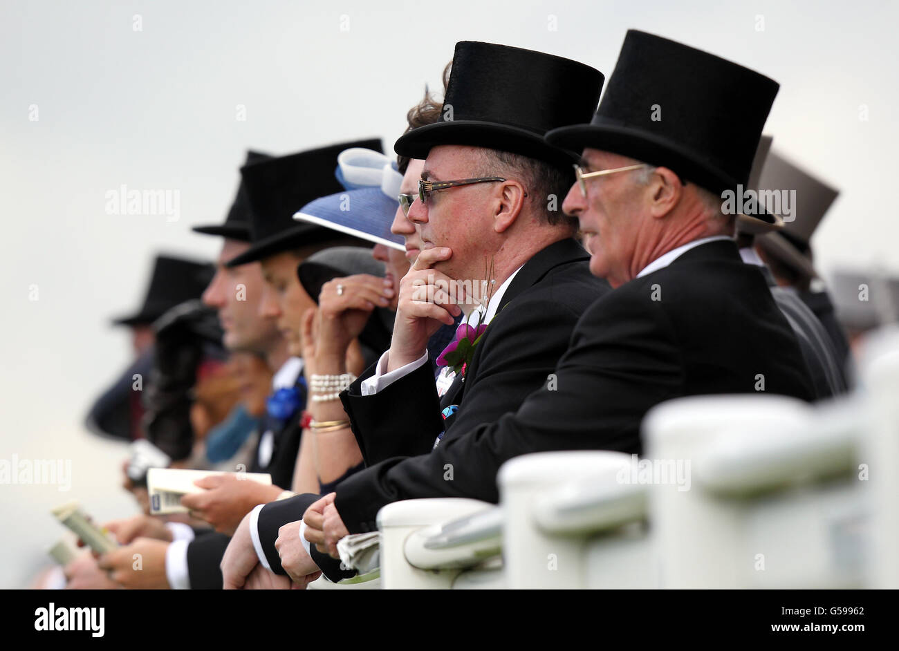 Race goers watch the Wolferton Handicap during day four of the 2012 Royal Ascot meeting at Ascot Racecourse, Berkshire. Stock Photo