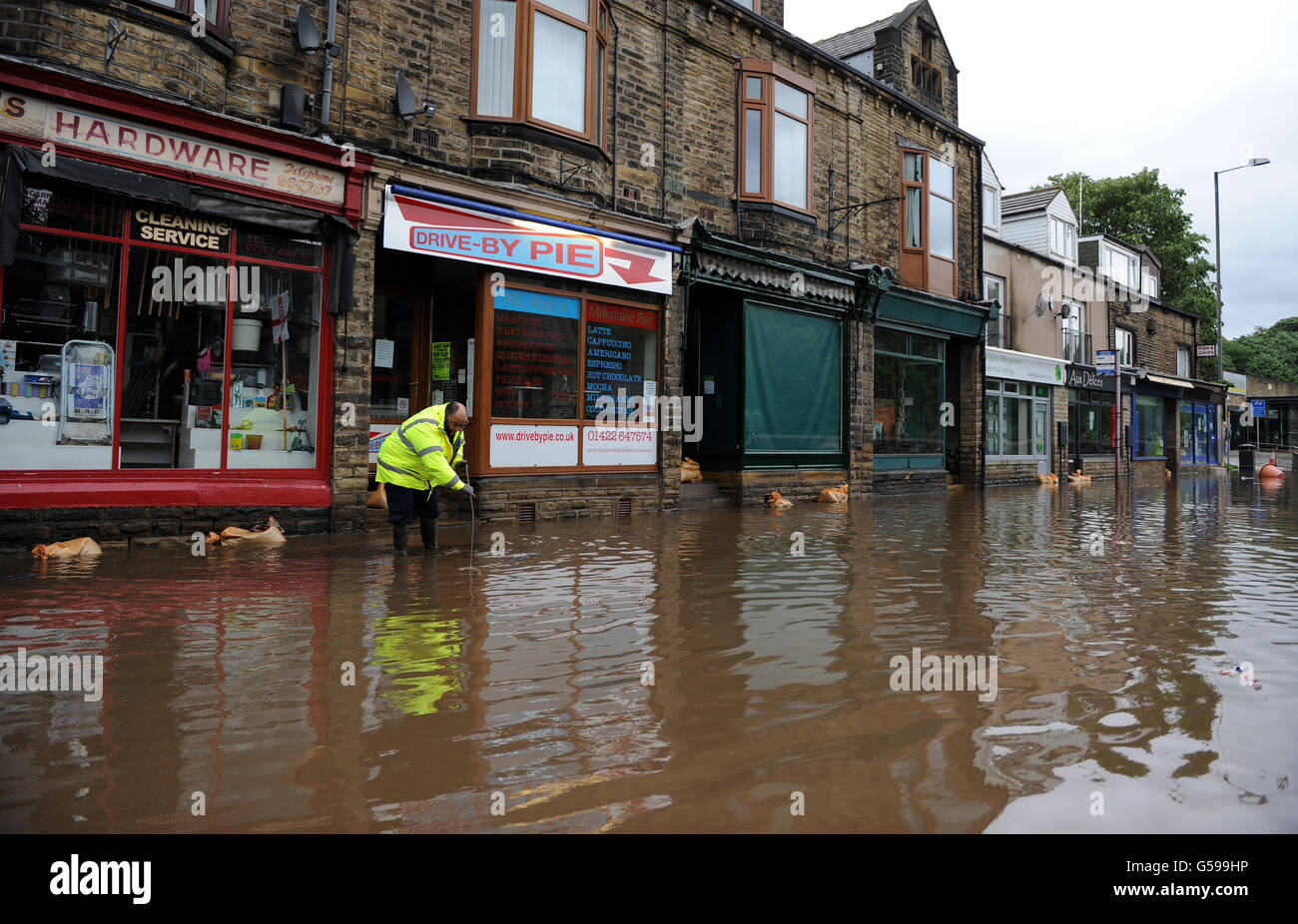 Floodwaters surrounds local shops in the centre of Mytholmroyd near
