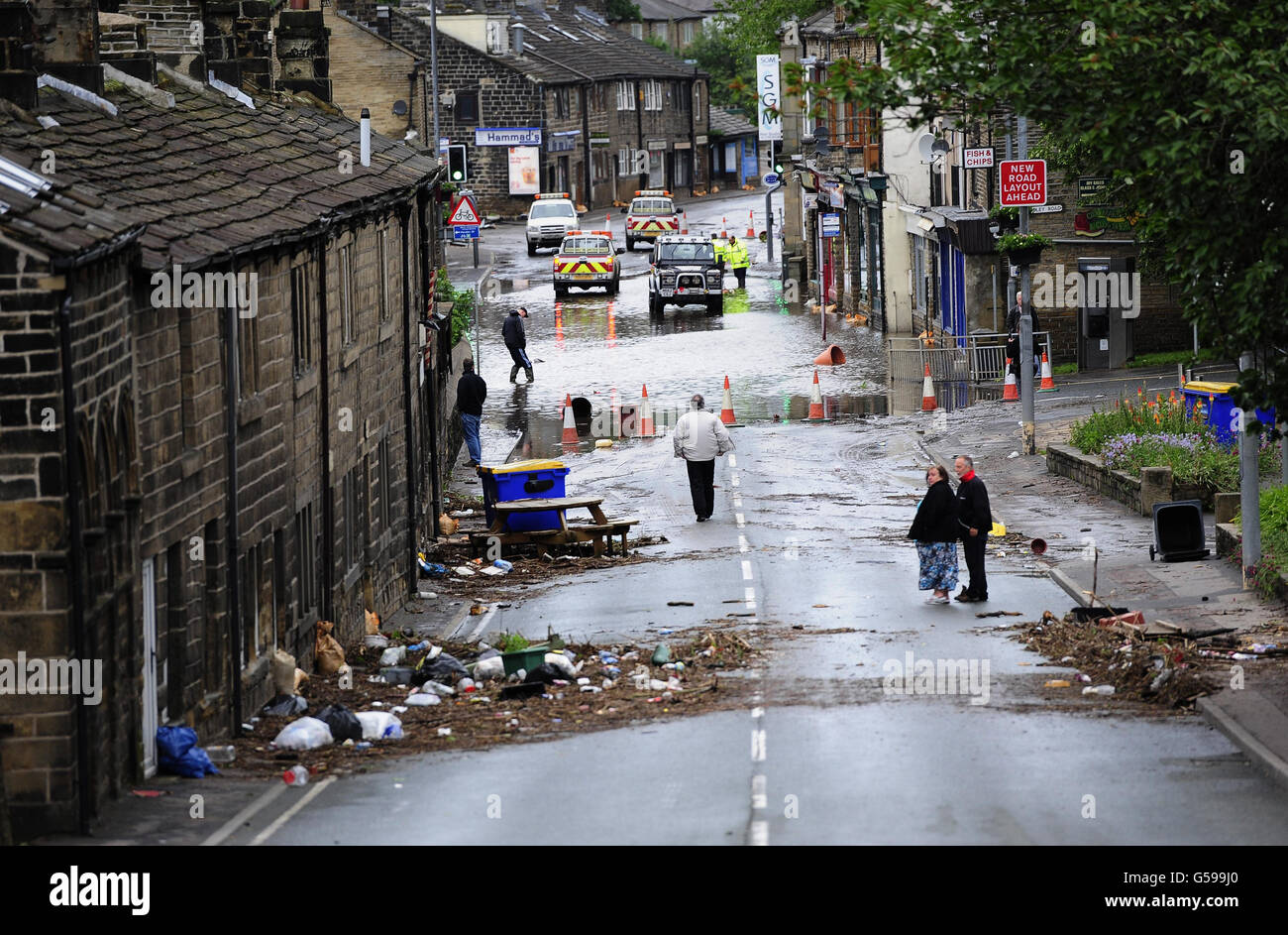 Floodwaters surrounds local shops in the centre of Mytholmroyd near