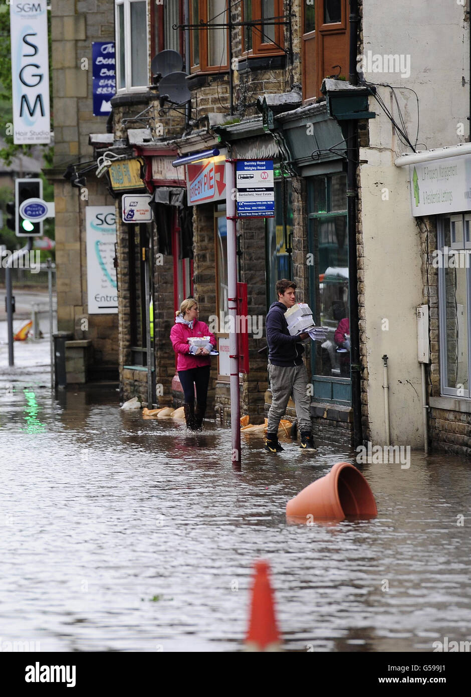 Floodwaters surrounds local shops in the centre of Mytholmroyd near