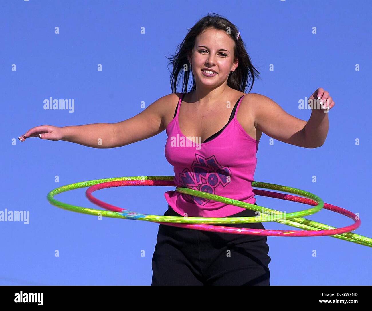 Sam Bradley, 19, from Oxted in Surrey demonstrate's Wave Hoops - a liquid filled Hula hoop - at the Toy Fair in London's Docklands. *...Toy manufacturers exhibiting at the industry's annual showcase have clubbed together to give toys worth around 25,000 for Children with Leukaemia. The Toy Fair, meanwhile, is now in its 48th year, with nearly 350 exhibitors expected to play host to an anticipated 17,000 visitors from more than 60 countries. Stock Photo