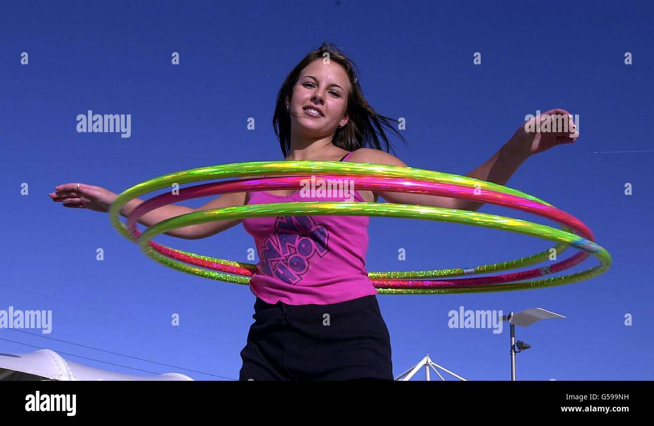 7 year old girl using a hula hoop Stock Photo - Alamy