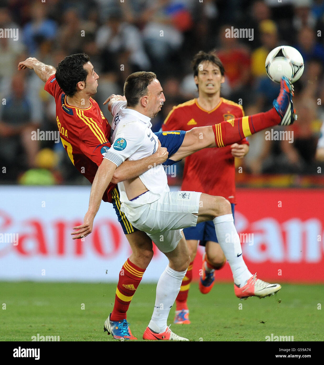 Soccer - UEFA Euro 2012 - Quarter Final - Spain v France - Donbass Arena. Spain's Alvaro Arbeloa tackles France's Franck Ribery Stock Photo